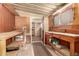 Unfinished utility room with open shelving and access to rest of house at 5221 E Mills Ct, Mesa, AZ 85215