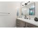 Bathroom vanity with white countertop, wood cabinets, and matte black hardware at 5224 S Monaco Dr, Tempe, AZ 85283