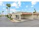 Inviting single-story home featuring a carport, desert landscaping, and a charming facade with palm trees in the front yard at 5224 S Monaco Dr, Tempe, AZ 85283