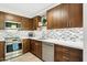 Updated kitchen with stainless steel appliances and attractive tile backsplash at 5224 S Monaco Dr, Tempe, AZ 85283