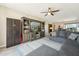 Cozy living room with an entertainment center, a ceiling fan, and an L-shaped sofa at 5224 S Monaco Dr, Tempe, AZ 85283
