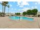 A refreshing outdoor pool surrounded by lounge chairs and lush greenery at 5224 S Monaco Dr, Tempe, AZ 85283