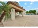 An outdoor pool area with covered seating and lush landscaping at 5224 S Monaco Dr, Tempe, AZ 85283