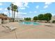 Community pool with lounge chairs and mature landscaping at 5224 S Monaco Dr, Tempe, AZ 85283