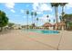 A community pool area featuring mature palms and desert landscaping at 5224 S Monaco Dr, Tempe, AZ 85283