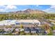 Expansive aerial view showing city landscape with a large building, mountains, and surrounding neighborhoods at 5533 E Earll Dr, Phoenix, AZ 85018