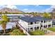 Aerial view of modern homes with manicured lawns, complemented by mountain views and a clear sky at 5533 E Earll Dr, Phoenix, AZ 85018