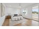 Modern bedroom featuring a plush bed, natural light, and a private balcony access at 5533 E Earll Dr, Phoenix, AZ 85018