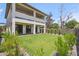 Expansive backyard featuring lush green grass, manicured hedges and a covered patio at 5537 E Earll Dr, Phoenix, AZ 85018