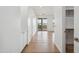 Hallway with wood floors leading to a bright, open space, showcasing the home's inviting layout at 5537 E Earll Dr, Phoenix, AZ 85018