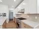 Modern kitchen featuring white cabinetry, stainless steel appliances, and a gas range at 5537 E Earll Dr, Phoenix, AZ 85018