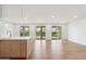 Spacious living room featuring hardwood floors and sliding glass doors leading to the backyard at 5537 E Earll Dr, Phoenix, AZ 85018