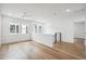 Open and airy loft area with hardwood floors, a ceiling fan, and an abundance of natural light at 5537 E Earll Dr, Phoenix, AZ 85018
