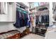 Walk-in closet with organized shelving, hanging space, and room for shoes and accessories at 5628 N Rattler Way, Litchfield Park, AZ 85340