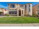Charming two-story home featuring well-maintained landscaping and a welcoming front entrance at 5628 N Rattler Way, Litchfield Park, AZ 85340