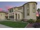 Attractive home exterior with a manicured lawn and unique architectural details at 5628 N Rattler Way, Litchfield Park, AZ 85340