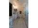 Bright bathroom showcasing tile floors, vanity with modern hardware, glass shower and closet at 5633 N 206Th Ave, Buckeye, AZ 85396