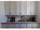 Light and bright kitchenette area with ample storage and countertop space at 5633 N 206Th Ave, Buckeye, AZ 85396