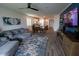 Spacious, open-concept living room with comfortable seating and a dining area at 5633 N 206Th Ave, Buckeye, AZ 85396