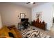 Spacious office with sofa, desk, computer setup, stylish decor, and natural light, perfect for remote work at 5633 N 206Th Ave, Buckeye, AZ 85396