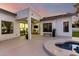 Covered patio offers seamless indoor/outdoor living and access to the backyard pool and spa at 6518 W Louise Dr, Glendale, AZ 85310