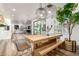 Open-concept dining area with stylish fixtures and wood table at 6518 W Louise Dr, Glendale, AZ 85310