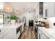 Bright, modern kitchen features a large island, stainless appliances, and stylish pendant lighting at 6518 W Louise Dr, Glendale, AZ 85310