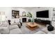 Chic living room with a fireplace, large television, and cozy sectional sofa at 6518 W Louise Dr, Glendale, AZ 85310