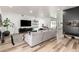 Cozy living room showcasing wood floors and a spacious layout at 6518 W Louise Dr, Glendale, AZ 85310