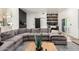 Bright living room featuring a comfortable sectional sofa and modern decor at 6518 W Louise Dr, Glendale, AZ 85310