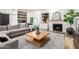 Modern living room boasts a sleek fireplace, a custom bar area, and stylish furniture at 6518 W Louise Dr, Glendale, AZ 85310