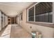 Spacious covered back patio area with storage room at end, offering relaxation and utility at 6812 N Polk St # 223, Phoenix, AZ 85043