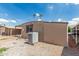 Backyard view of the property featuring desert landscaping and shade at 6812 N Polk St # 223, Phoenix, AZ 85043