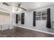 Bedroom featuring a ceiling fan, and two windows, providing natural light at 6812 N Polk St # 223, Phoenix, AZ 85043