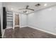 Spacious bedroom with a ceiling fan, recessed lights, and en suite bathroom at 6812 N Polk St # 223, Phoenix, AZ 85043
