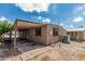 Exterior view of the home with a covered patio area and well-maintained yard at 6812 N Polk St # 223, Phoenix, AZ 85043