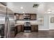 Updated kitchen featuring stainless steel appliances and wooden cabinets at 6812 N Polk St # 223, Phoenix, AZ 85043