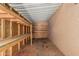 Inside view of the storage shed with ample shelving for organized storage at 6812 N Polk St # 223, Phoenix, AZ 85043