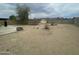 Spacious backyard with gravel landscaping, patio area, and privacy fencing, perfect for outdoor activities and relaxation at 6832 W Vogel Ave, Peoria, AZ 85345