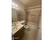 Functional bathroom features a single vanity, a toilet, and a shower-tub combination with tiled walls at 6832 W Vogel Ave, Peoria, AZ 85345