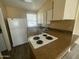 Cozy kitchen with essential appliances, ample counter space, and a window that provides natural light at 6832 W Vogel Ave, Peoria, AZ 85345