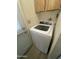 Functional laundry area featuring a washing machine and built-in storage, designed for efficient use of space at 6832 W Vogel Ave, Peoria, AZ 85345