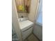 Compact laundry area with a dryer and overhead cabinet, providing efficient space for laundry needs at 6832 W Vogel Ave, Peoria, AZ 85345