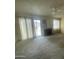 Inviting living room with a fireplace and sliding glass doors to the outside, offering a cozy and bright space at 6832 W Vogel Ave, Peoria, AZ 85345