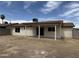 A home's backyard and patio featuring a neutral paint scheme, blue sky and lush trees at 7007 S 45Th Pl, Phoenix, AZ 85042