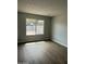 Bedroom with updated flooring and a view of the backyard at 7007 S 45Th Pl, Phoenix, AZ 85042