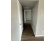 Hallway featuring fresh paint and modern flooring at 7007 S 45Th Pl, Phoenix, AZ 85042