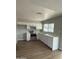 Bright kitchen featuring modern stainless steel appliances and white cabinetry at 7007 S 45Th Pl, Phoenix, AZ 85042