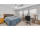 Bedroom with a queen bed, chair, desk, and bright natural lighting at 726 E Rose Marie Ln, Phoenix, AZ 85022