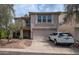 Two-story home with a two car garage, desert landscaping, and a white SUV parked on the driveway at 726 E Rose Marie Ln, Phoenix, AZ 85022